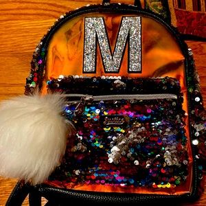 Justice letter “M” book bag with rainbow Sienkiewicz